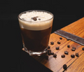 Traditional espresso macchiato topped with a small amount of steamed milk
