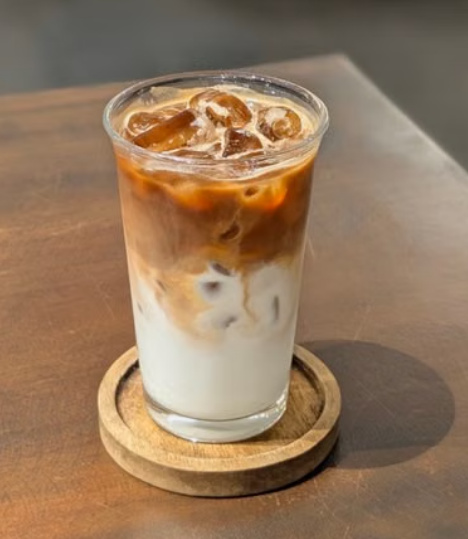 Iced latte with espresso, milk, and ice in a clear glass