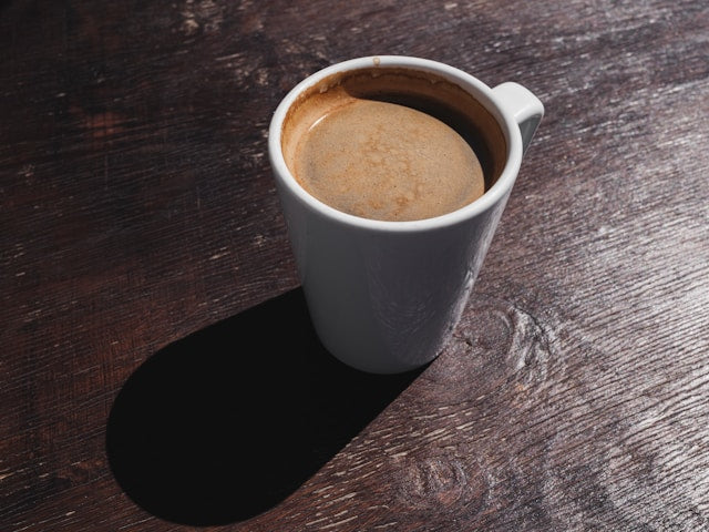 Hot Americano coffee in a white ceramic cup